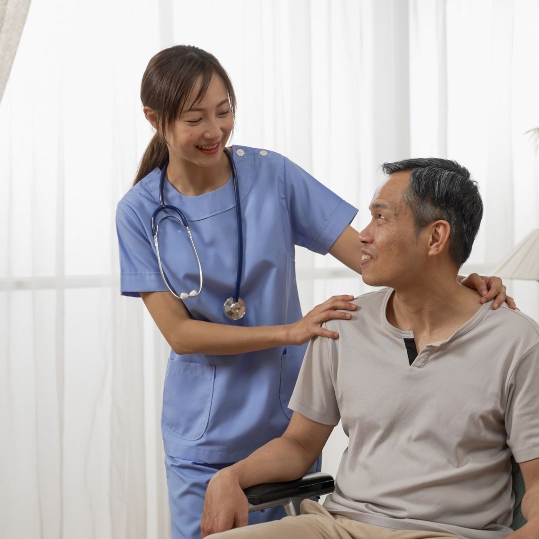 Staff interacting with patient in a friendly setting