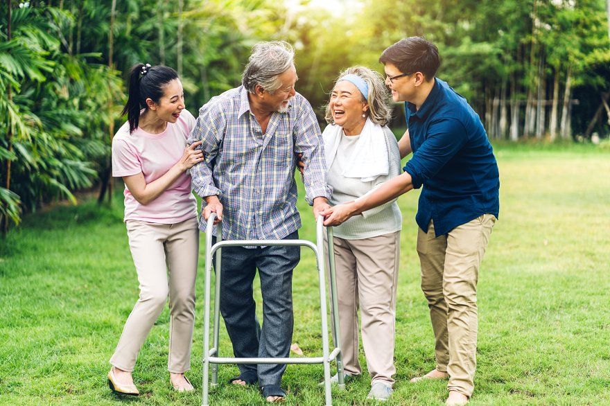 Senior patients being assisted outdoors