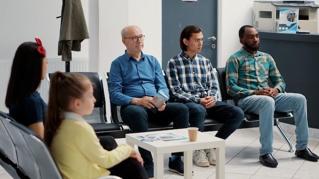 Visitors seated in a waiting area